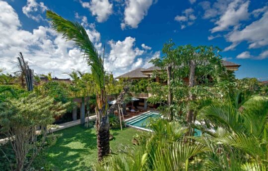 Aerial view of villa with pool and garden