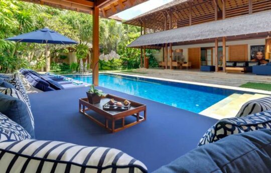 Views of villa pool and tropical garden area with villa in background