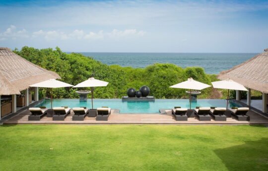 swimming pool and ocean views with day beds by the pool