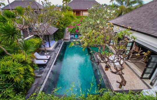 Aerial view of villa with swimming pool and day beds