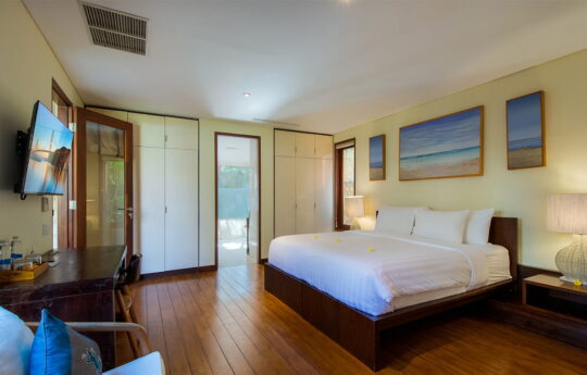 bedroom with TV and air conditioning