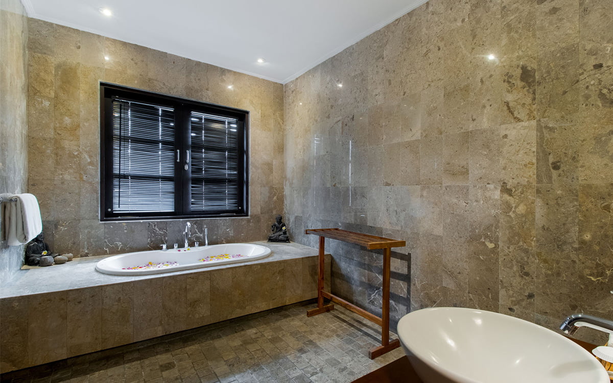 Ensuite bathroom of villa with bathtub