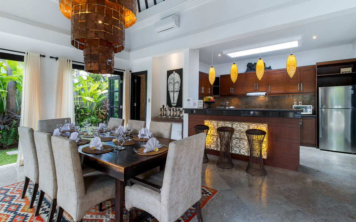 Kitchen and dining area with dining table set for 8 people
