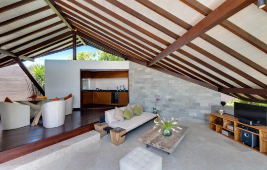 Living area of villa with flat screen tv and sofa