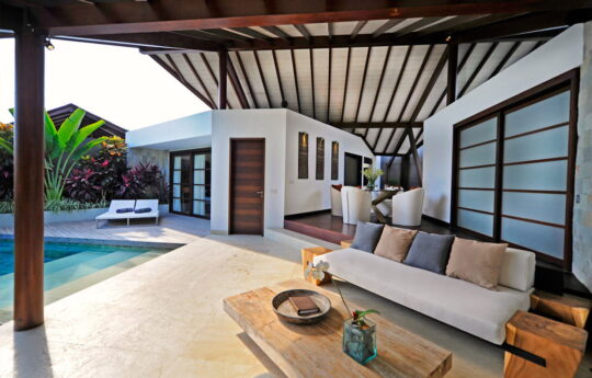 Outdoor lounge area with view of pool and deck area