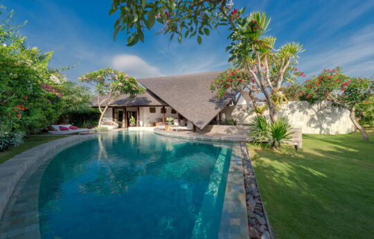 The Layar 3 bedroom Swimming pool or tropical bali villa in Seminyak on sunny day with villa in background