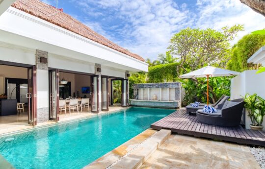 Villa Amala Swimming pool, deck area with daybeds and Villa Amala interiors in background