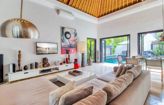 Lounge room with sofa and flat screen tv in villa