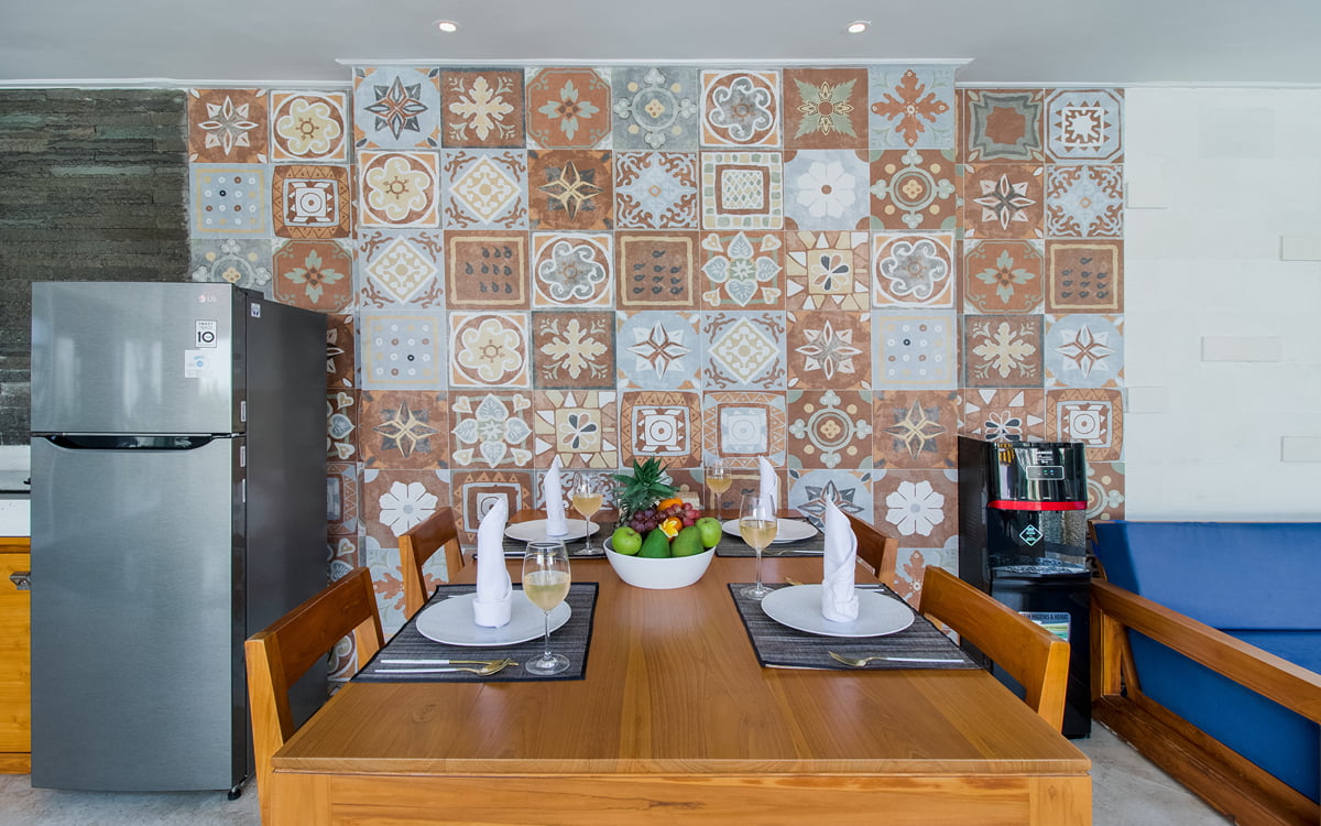 Kitchen dining table and fridge in background