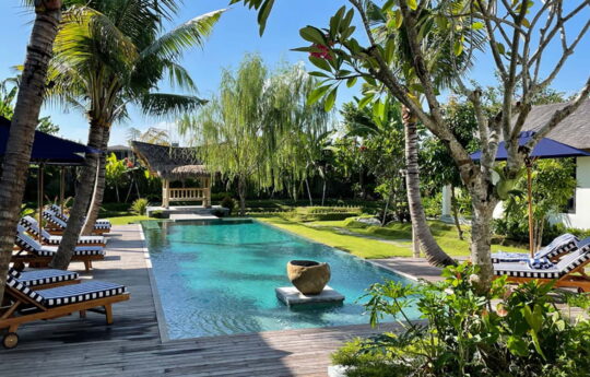 Swimming pool and day beds with views of Villa Bogor