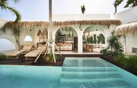 Villa Bondi View of interior kitchen areas with swimming pool in foreground during sunny day