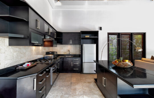 Modern kitchen and island eating bench in villa