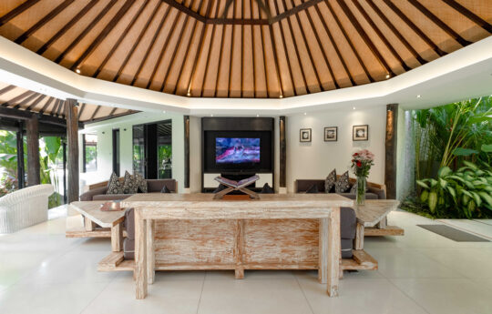 Living room of villa with two couches and flat screen tv