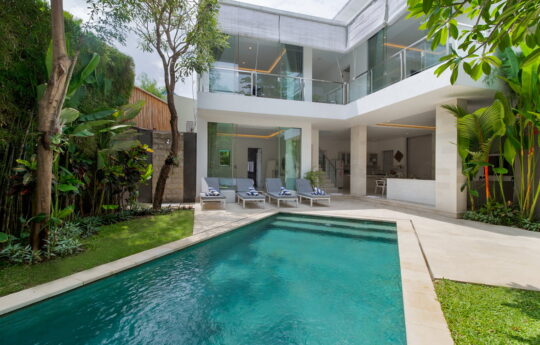 Swimming pool and two level villa exterior views