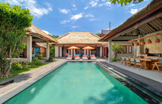 Villa Mahkota Swimming pool view of sunny day with villa exterior