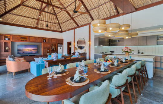 Open plan loung and dining area of villa with flat screen tv