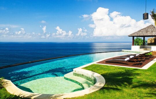 Views of ocean from cliff top villa with pool in foreground