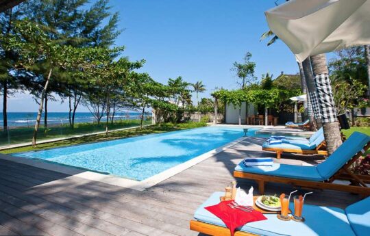 Villa Puri Nirvana Villa Puri Nirvana swimming pool and deck area with daybeds on a sunny day