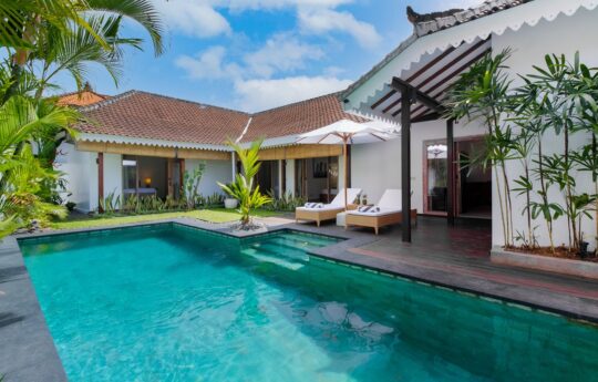 Villa Santi Swimming pool on a sunny day with views to entire villa