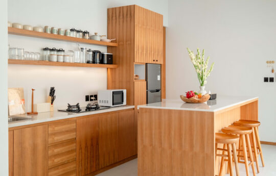 Modern kitchen with island bench and chairs for 3 persons