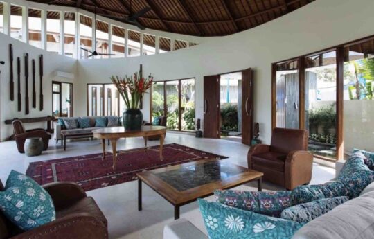 Lounge area of villa with sofa and coffee table