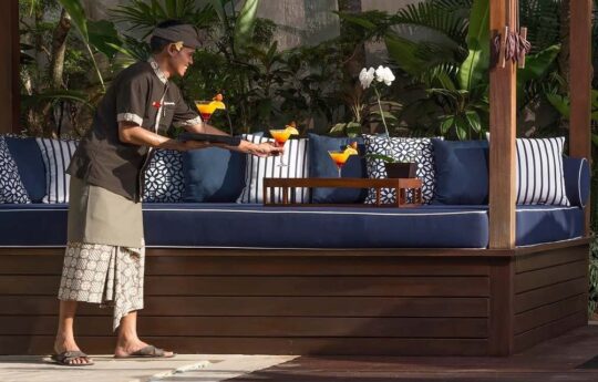 Balinese staff of villa serving 3 cocktails