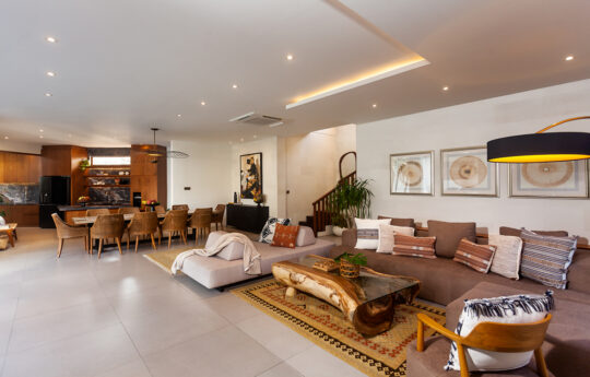 Lounge and dining area of villa with sofa - all open plan