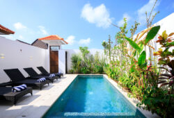 Rent Villa Madiba 2 - contact Bali Villa Escapes now! Swimming pool and day beds of Villa Madiba 2 on sunny day
