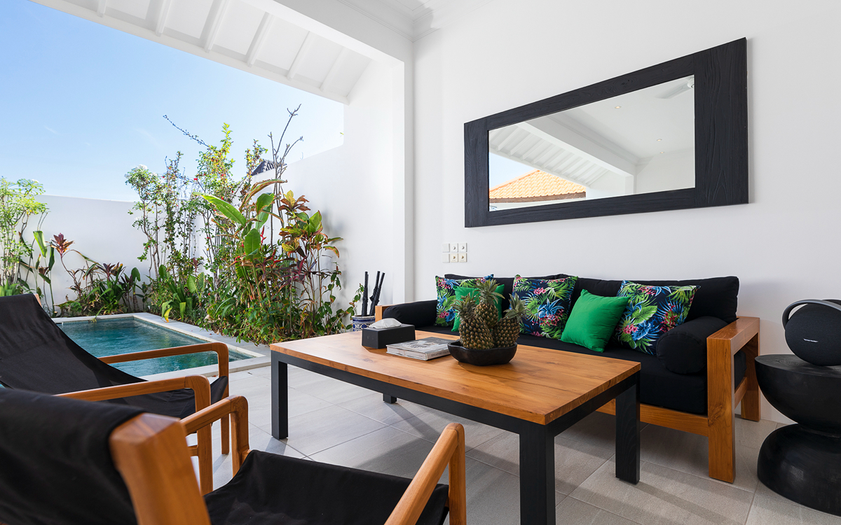 View of swimming pool and lounge area with coffee table