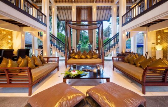 Open plan interiors of villa with rustic furniture